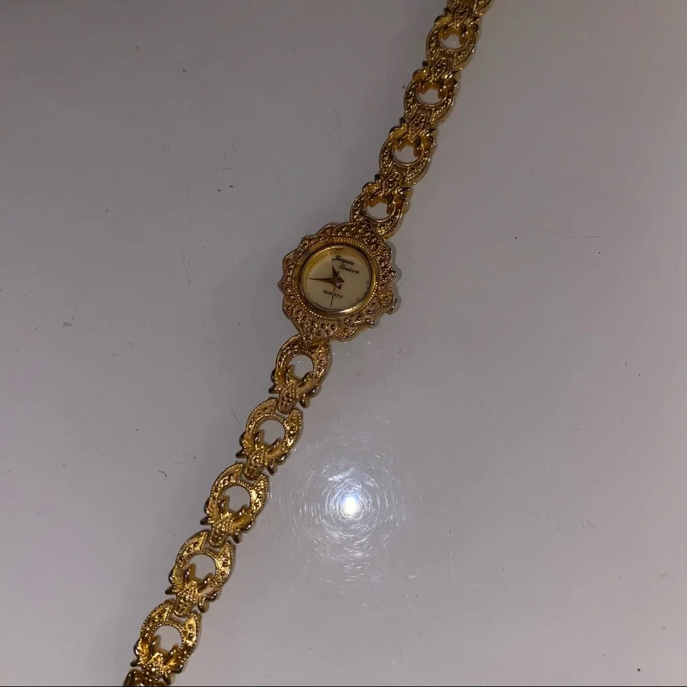 Jacques Couture Quartz movement gold‎ toned watch